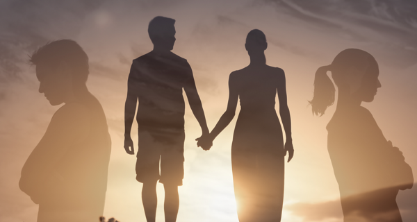 centrally a couple hold hands, to the side of the image they couple have their backs to one another